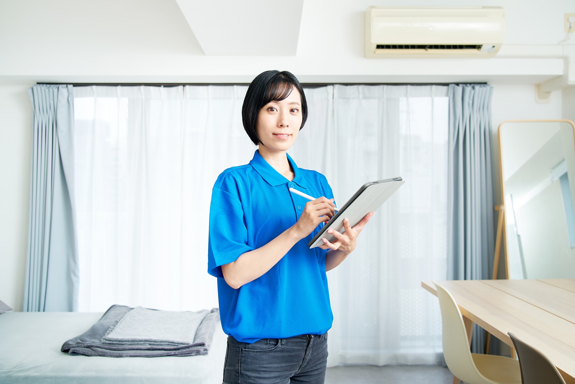 A woman checking the room